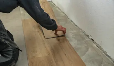 Expert flooring installation showcasing new hardwood or tile flooring in a modern home