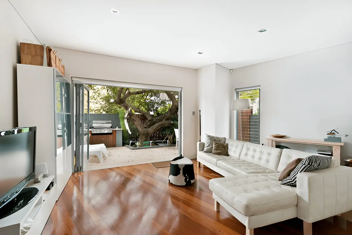 House Renovation Contractor transforming a modern living room with stylish finishes and updated interior design elements